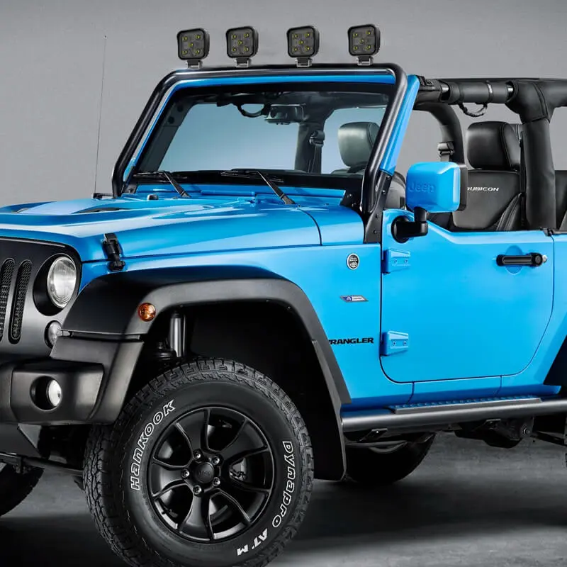 Four S0515B 4.2 inch square LED work light pods mounted on the roof rack of a blue Jeep Wrangler offroad vehicle